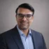Kamlesh Chandwani (Testimonial) A man, wearing a blue suit, smiles for the testimonial image.